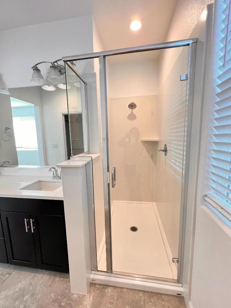 8362 Lemberger Way Sacramento, CA 95829 - Photo 20 of 28 a bathroom with a shower and a sink