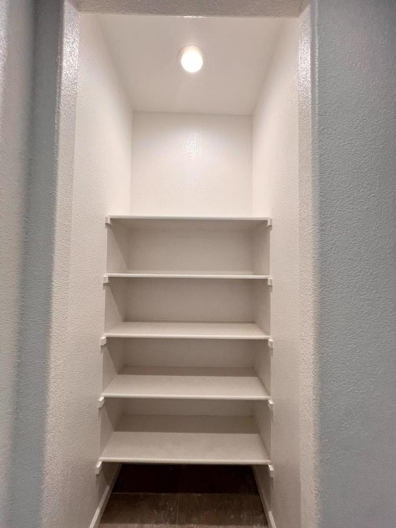 8362 Lemberger Way Sacramento, CA 95829 - Photo 24 of 28 a view of walk in closet with empty racks