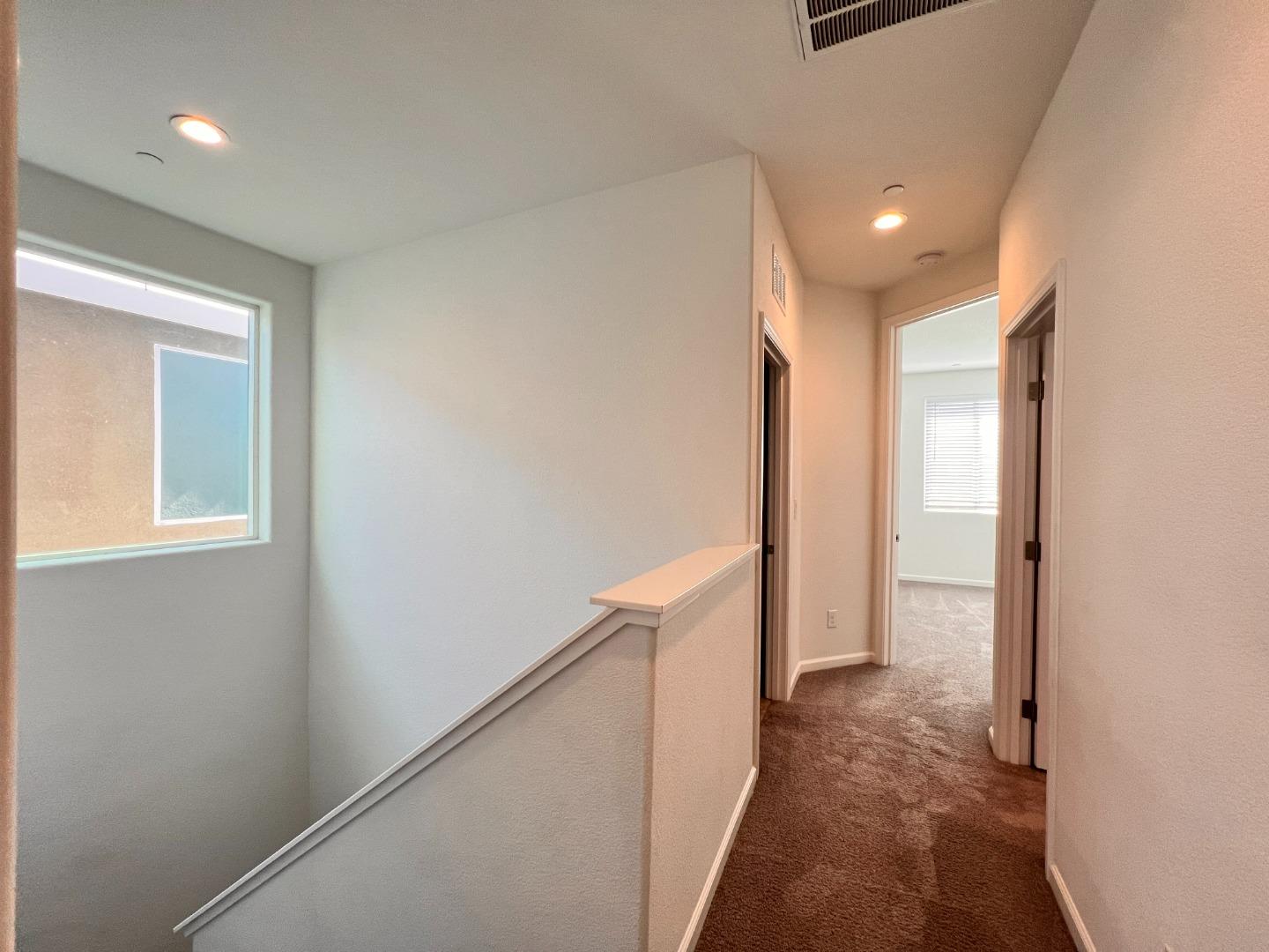 8362 Lemberger Way Sacramento, CA 95829 - Photo 25 of 28 a view of hallway with stairs and a window