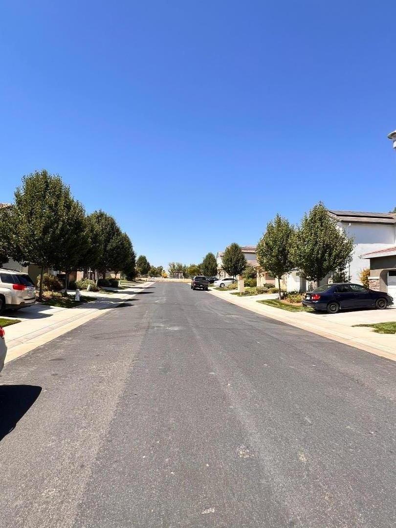 8362 Lemberger Way Sacramento, CA 95829 - Photo 27 of 28 a view of a street with a building in the background