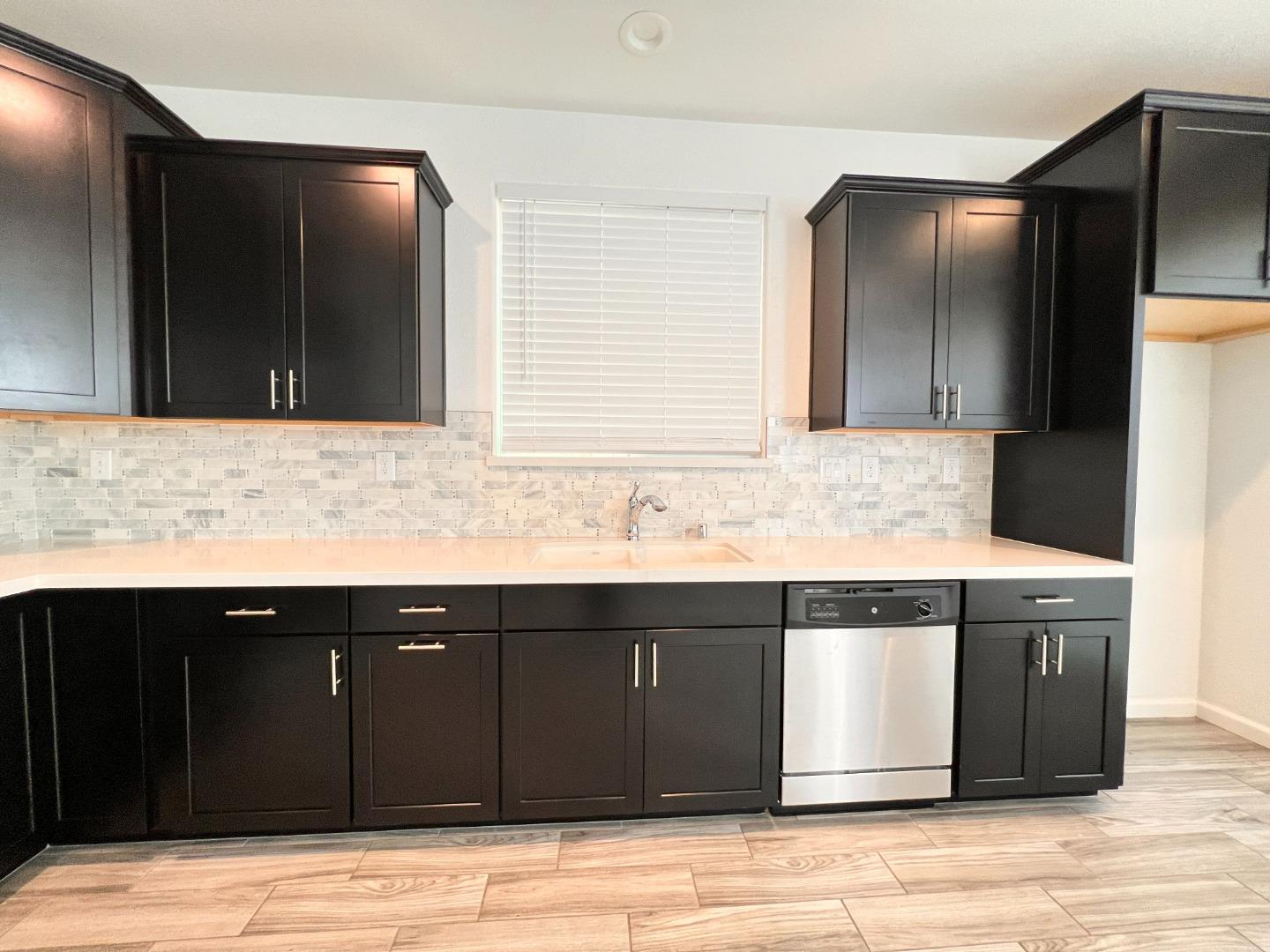 8362 Lemberger Way Sacramento, CA 95829 - Photo 7 of 28 a sink and granite counter top