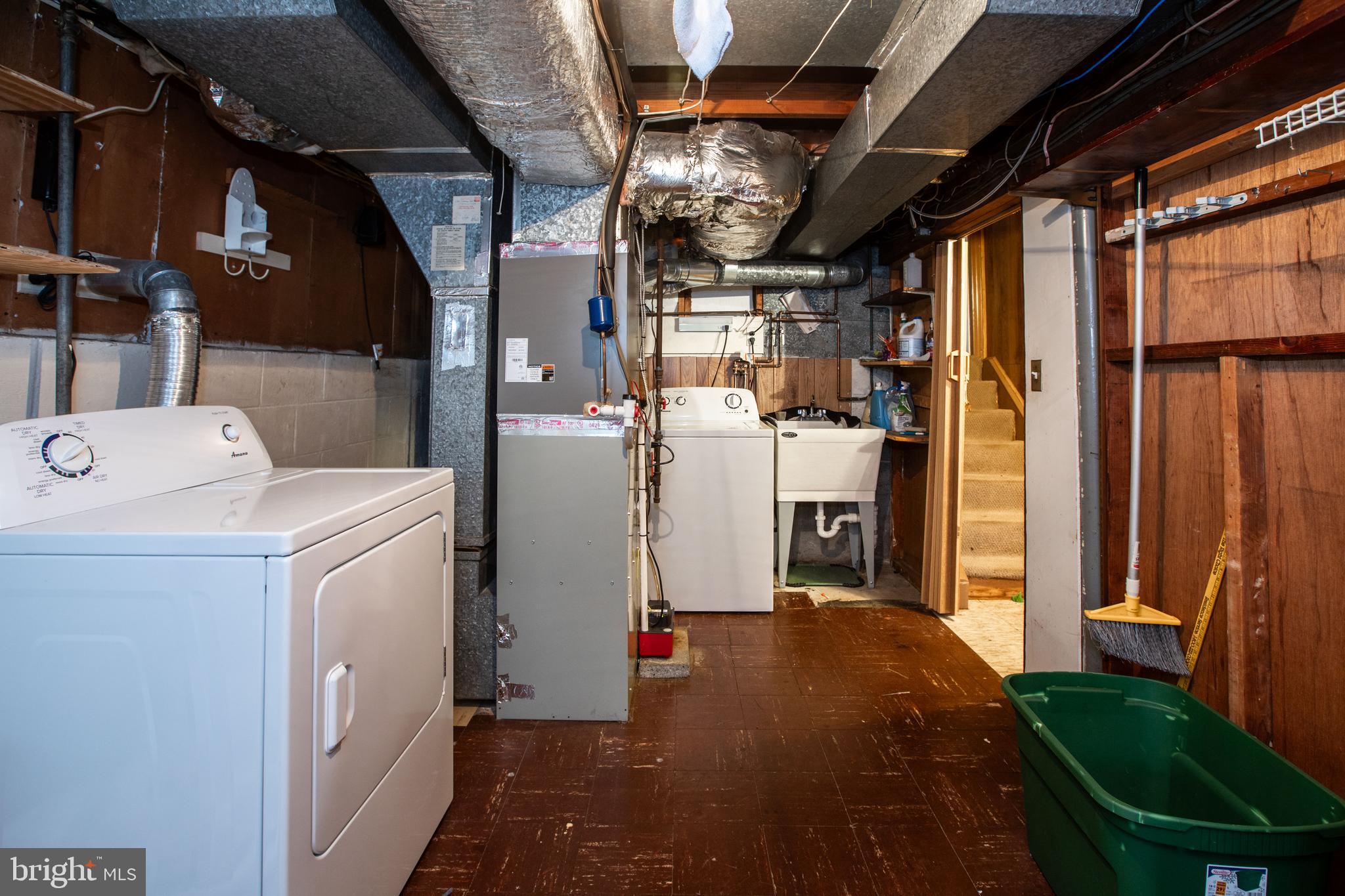 235 George Dye Road Hamilton, NJ 08690 - Photo 21 of 25 a view of storage and utility room with refrigerator and washer
