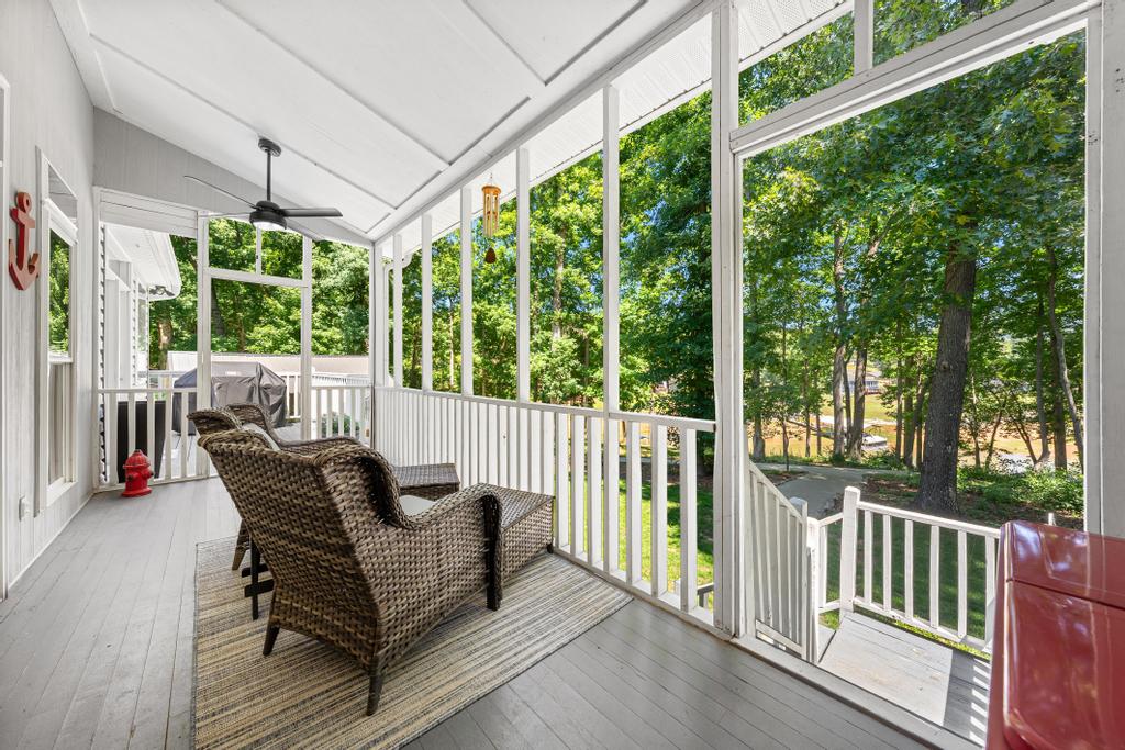217 Maret Road Townville, SC 29689 - Photo 21 of 35 A screened porch with high ceilings offers serene views of lush woodlands and tranquil water.
