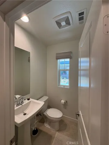 a view of a room with window and furniture