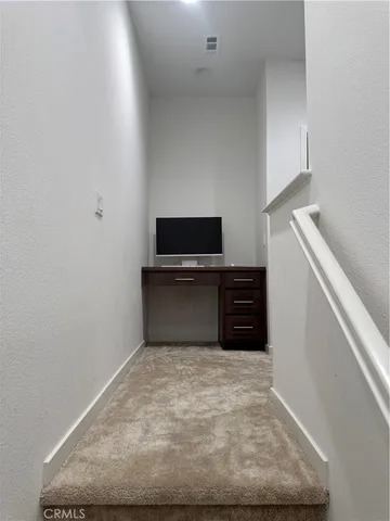 a white bath tub sitting next to a white toilet and sink