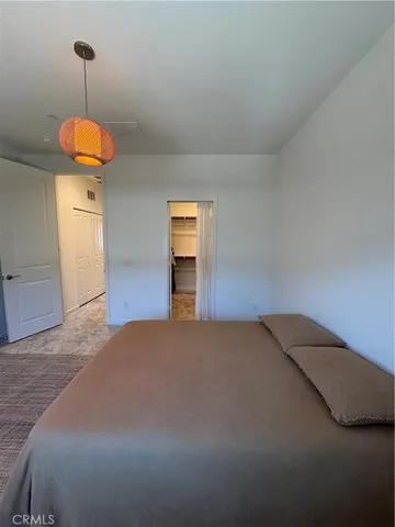 a view of a patio with couches table and chairs and potted plants