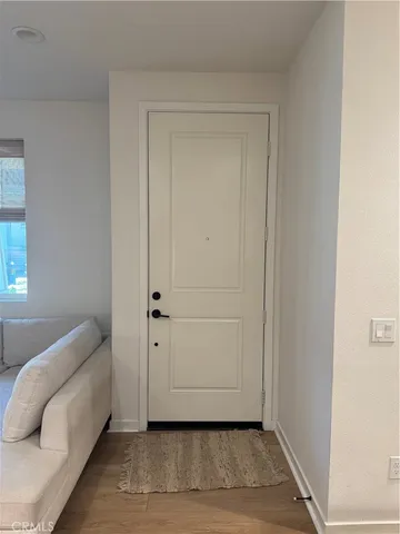 a kitchen with a table chairs stove and cabinets