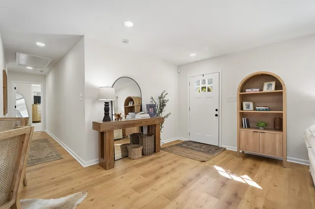 a view of a bedroom with a bed and furniture