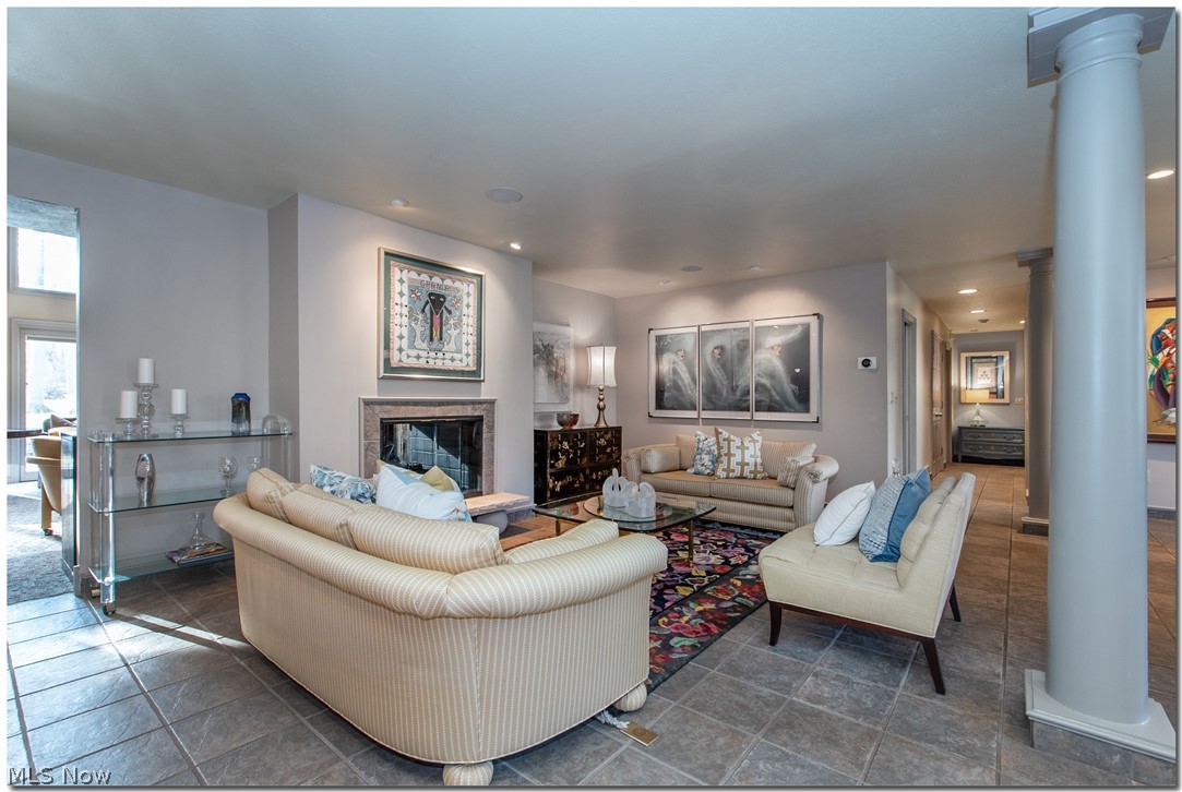 Open on three sides, the living room seems to float and mingle with other adjoining spaces.