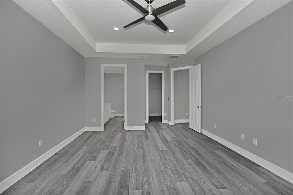 6237 Southwest 143rd Street Ocala, FL 34473 - Photo 22 of 35 wooden floor in an empty room with a window