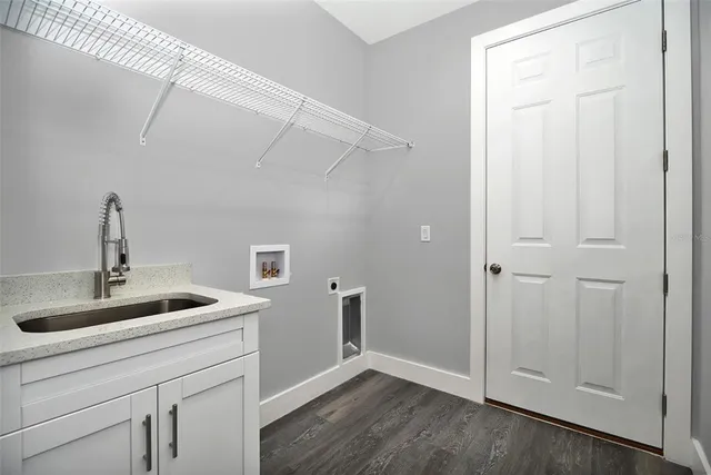 a kitchen with a sink and a mirror