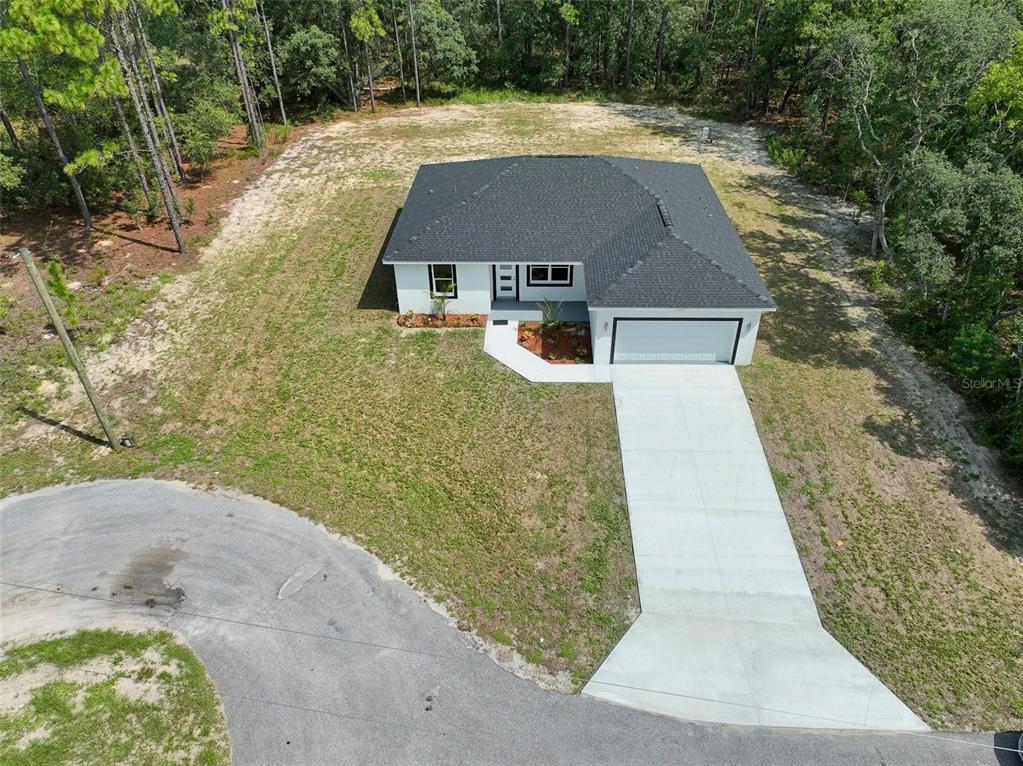 6237 Southwest 143rd Street Ocala, FL 34473 - Photo 4 of 35 a aerial view of a house with a yard