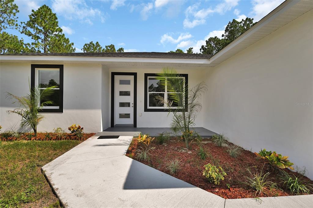 6237 Southwest 143rd Street Ocala, FL 34473 - Photo 6 of 35 a house view with a outdoor space