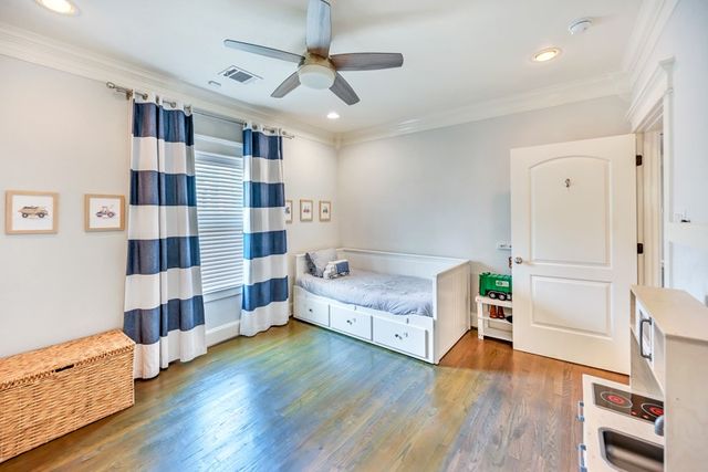 a spacious bedroom with a bed and a walk in closet