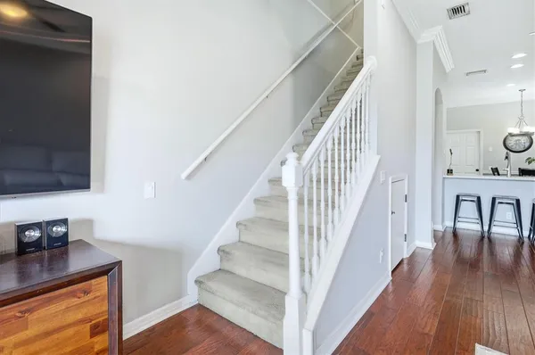 a view of entryway and hall with wooden floor