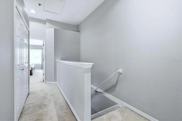 a view of a hallway with closet and entryway