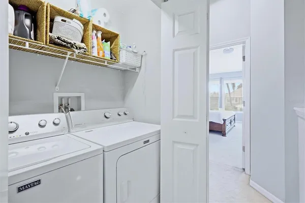 a utility room with dryer and washer