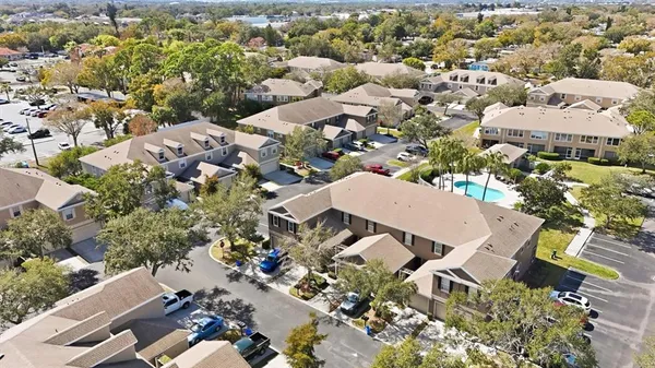 an aerial view of residential houses with outdoor space