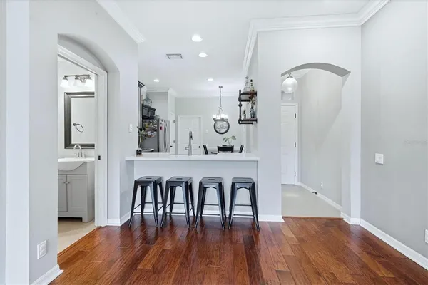 a view of dining room with furniture and wooden floor