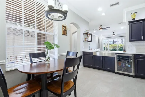 a kitchen with a table chairs and a stove