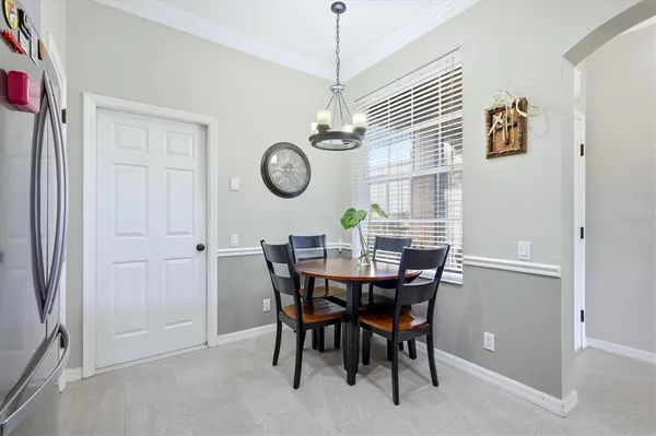 a view of a dining room and chandelier