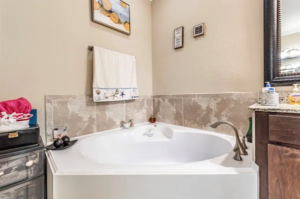 a bathroom with a shower and a sink