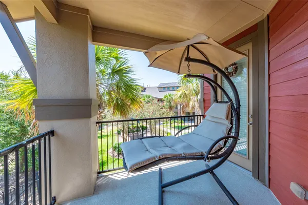 an empty room with a ceiling fan and a window