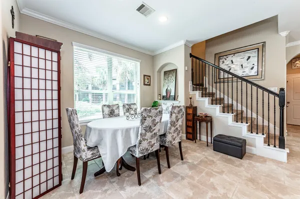 a view of a dining room with furniture window and outside view