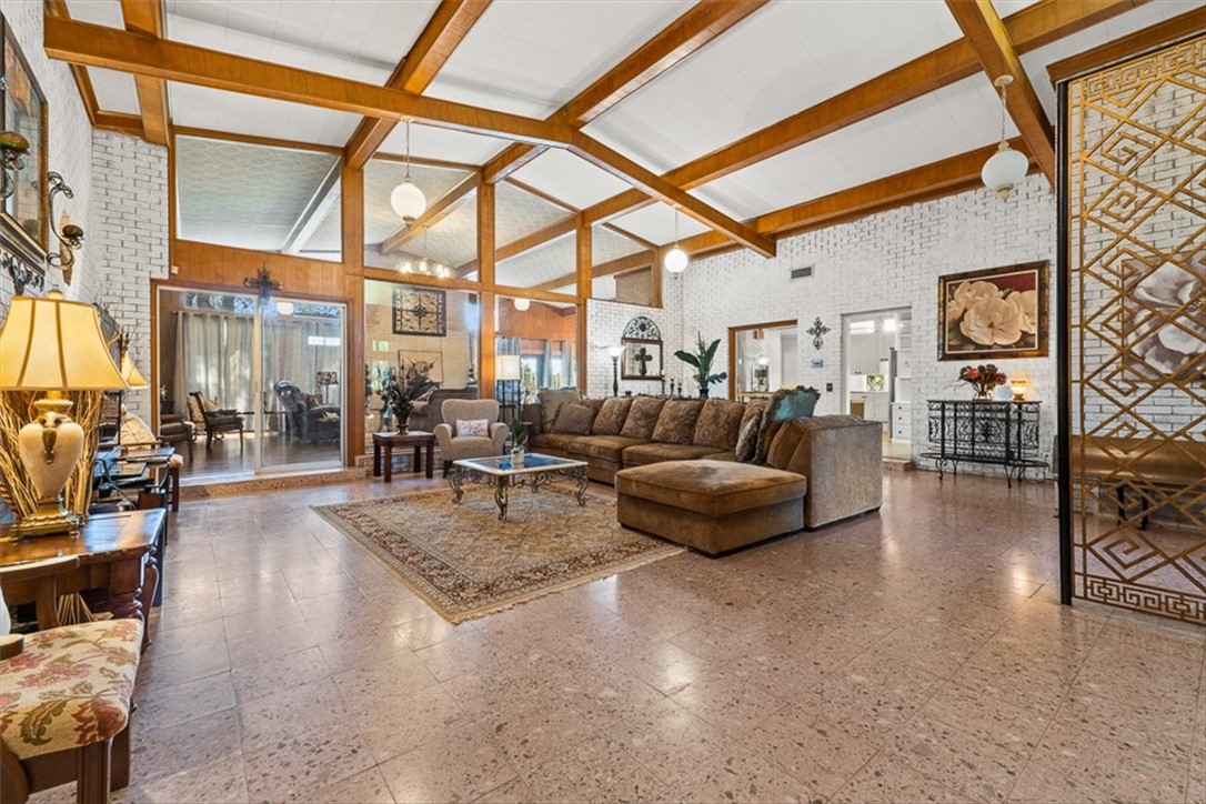 9675 County Road 325 Mathis, TX 78368 - Photo 13 of 29 a living room with furniture and a floor to ceiling window