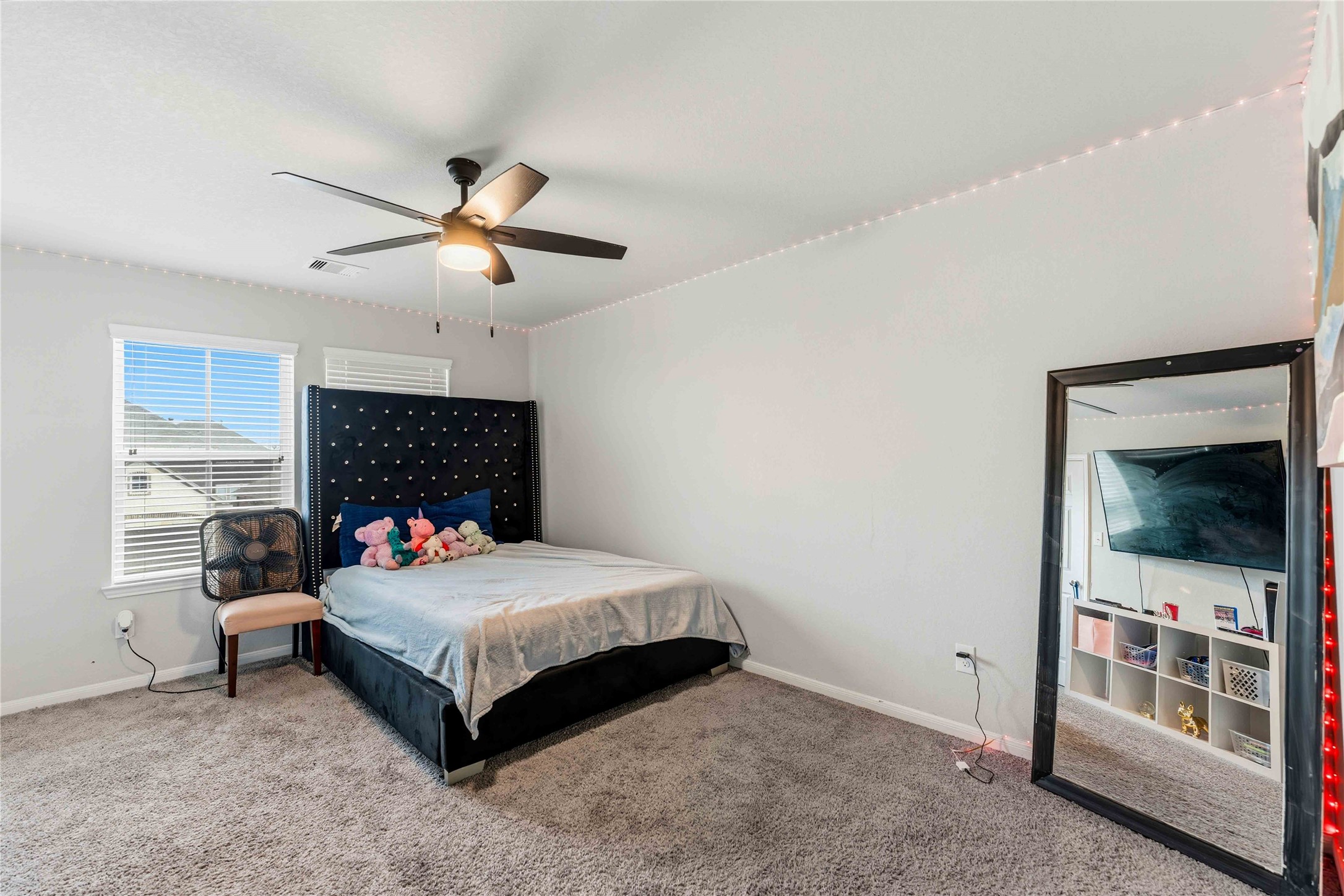 14810 Ruddy Duck Lane Houston, TX 77049 - Photo 18 of 33 a bedroom with a bed and a fireplace