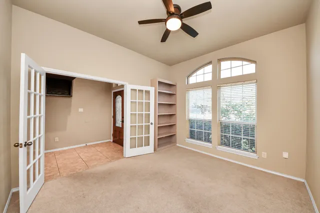 an empty room with entrance and door