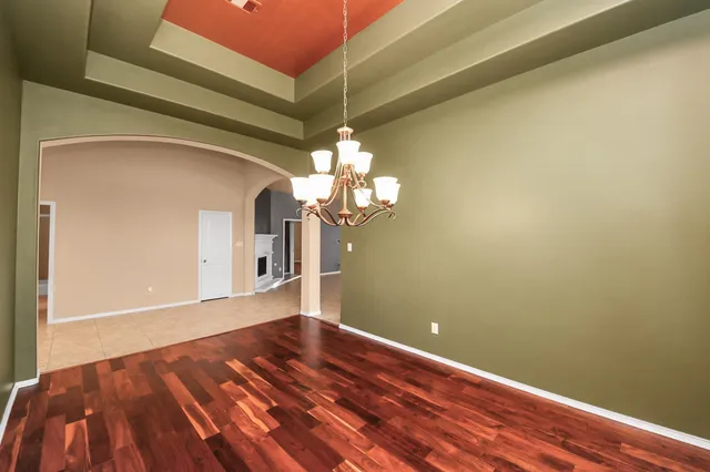 a view of an empty room and fire place