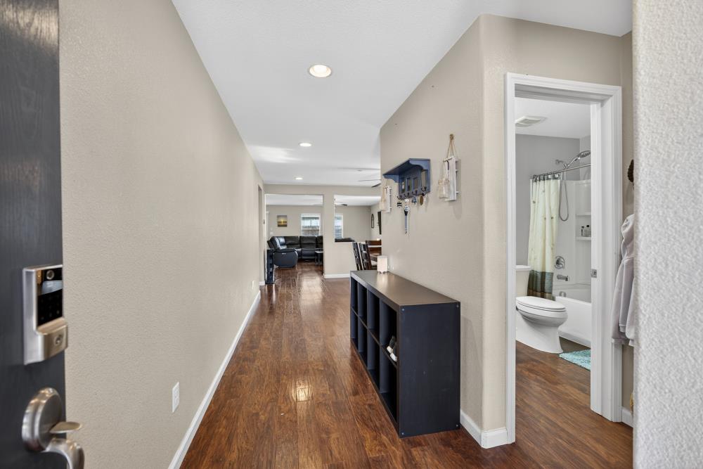 7467 Garden Ridge Way Sacramento, CA 95829 - Photo 15 of 54 a view of living room with furniture and wooden floor