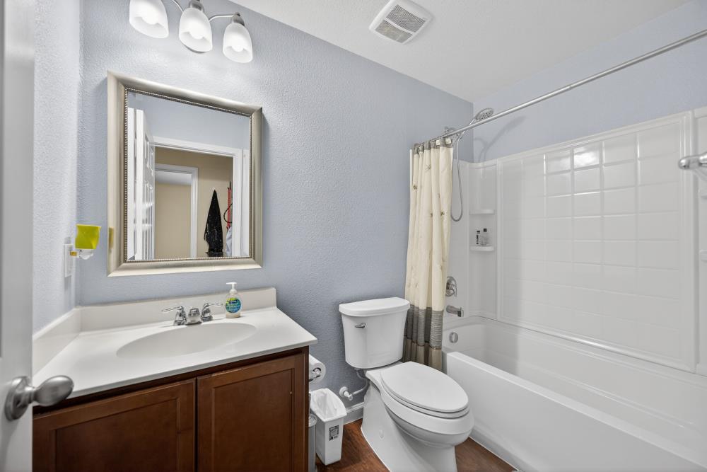 7467 Garden Ridge Way Sacramento, CA 95829 - Photo 16 of 54 a bathroom with a granite countertop sink toilet and shower