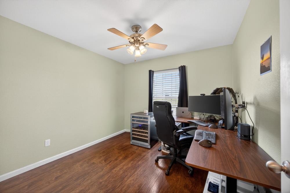 7467 Garden Ridge Way Sacramento, CA 95829 - Photo 18 of 54 a view of a workspace with furniture and a window