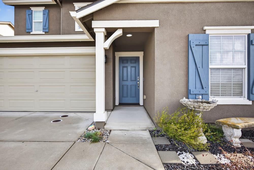 7467 Garden Ridge Way Sacramento, CA 95829 - Photo 2 of 54 a front view of a house