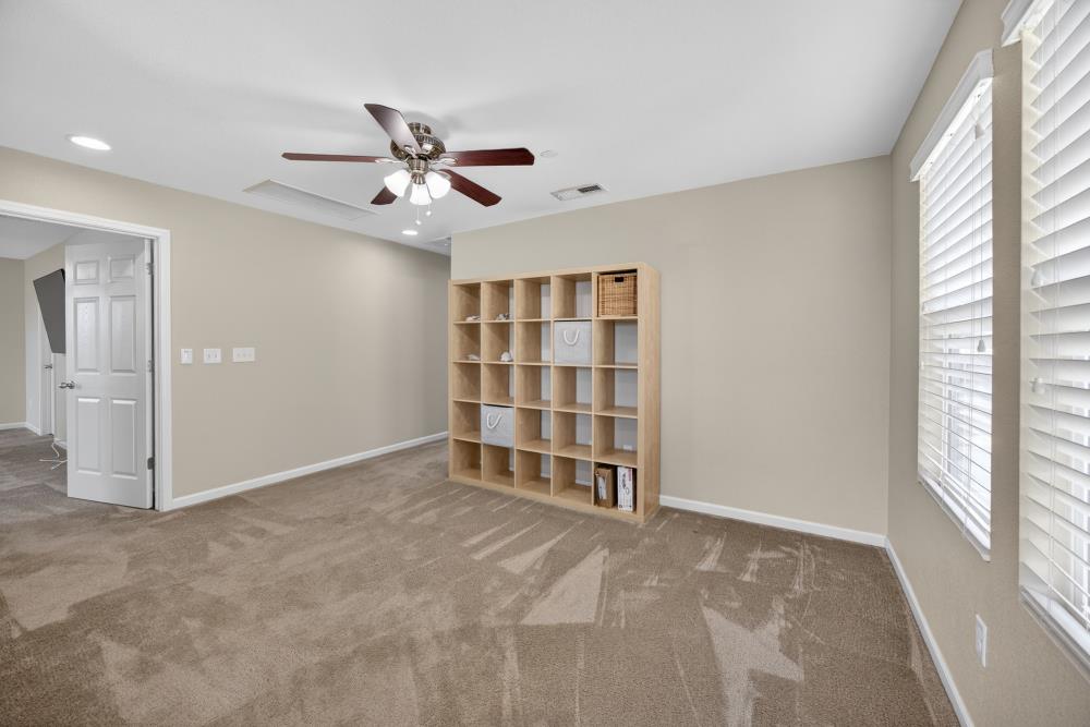 7467 Garden Ridge Way Sacramento, CA 95829 - Photo 21 of 54 a view of an empty room with a window