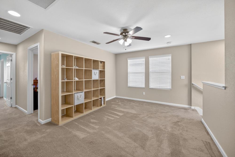 7467 Garden Ridge Way Sacramento, CA 95829 - Photo 22 of 54 a view of an empty room with a window