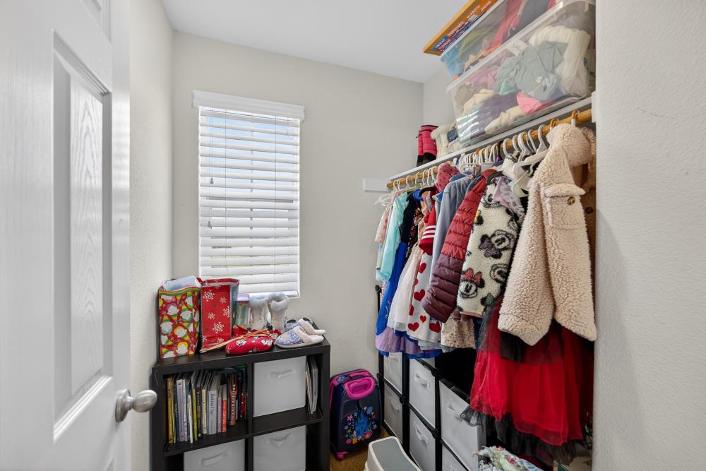 7467 Garden Ridge Way Sacramento, CA 95829 - Photo 30 of 54 a view of walk in closet with clothes