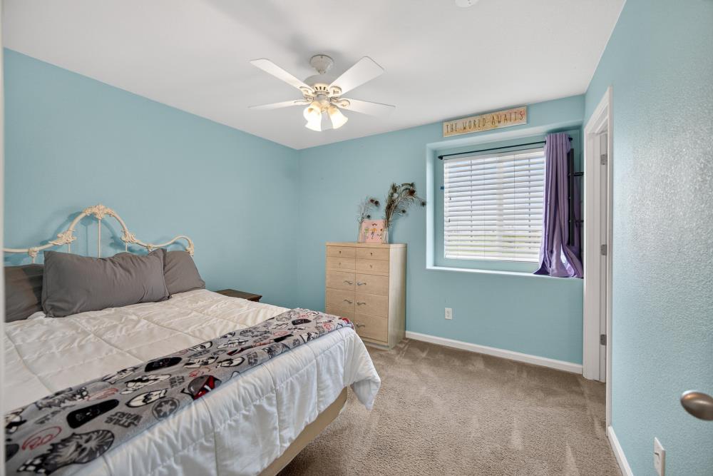 7467 Garden Ridge Way Sacramento, CA 95829 - Photo 31 of 54 a bedroom with a bed and a window