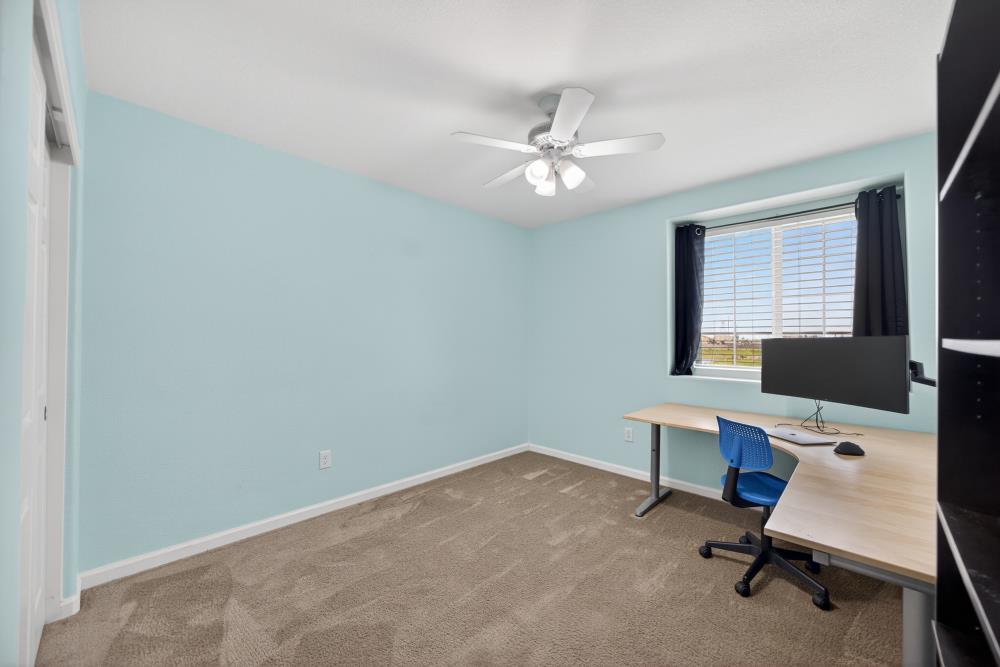 7467 Garden Ridge Way Sacramento, CA 95829 - Photo 37 of 54 a view of a workspace with furniture and a window
