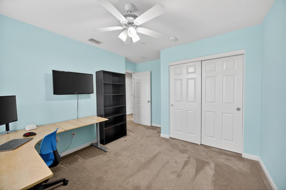 7467 Garden Ridge Way Sacramento, CA 95829 - Photo 38 of 54 a view of livingroom with furniture and flat screen tv