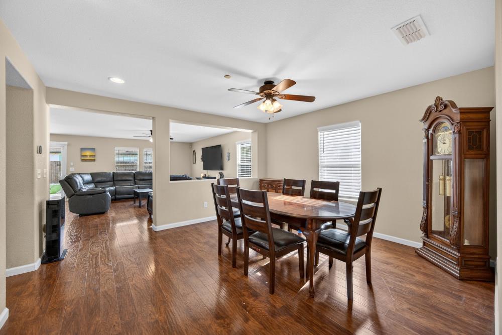 7467 Garden Ridge Way Sacramento, CA 95829 - Photo 4 of 54 a view of a dining room with furniture and wooden floor