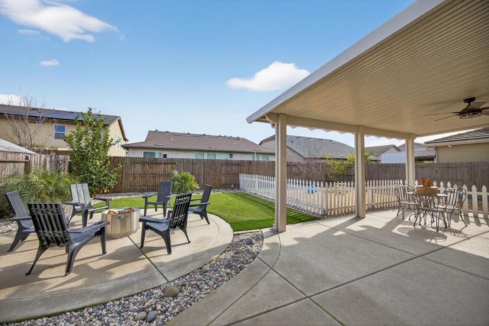 7467 Garden Ridge Way Sacramento, CA 95829 - Photo 42 of 54 a view of a patio with table and chairs and potted plants