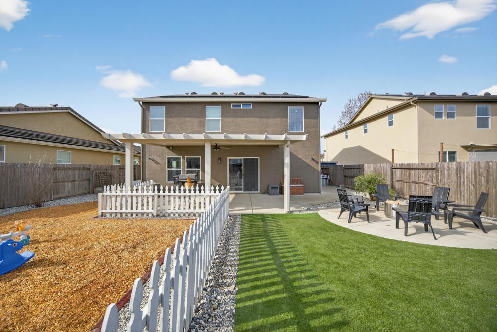 7467 Garden Ridge Way Sacramento, CA 95829 - Photo 44 of 54 a front view of a house with garden