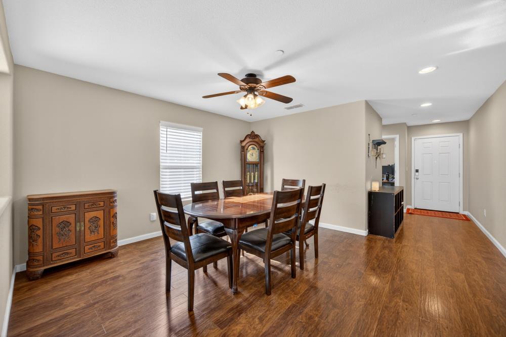 7467 Garden Ridge Way Sacramento, CA 95829 - Photo 5 of 54 a view of a dining room with furniture window and wooden floor
