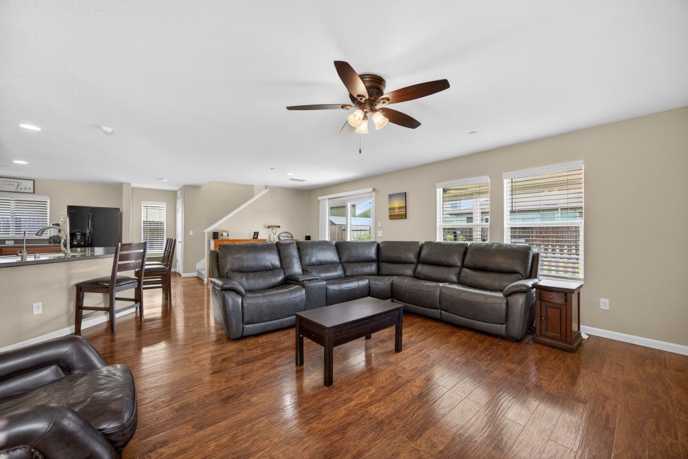 7467 Garden Ridge Way Sacramento, CA 95829 - Photo 8 of 54 a living room with furniture and a wooden floor