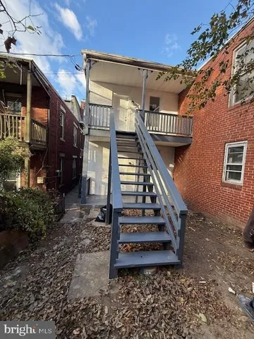 a front view of a house with stairs