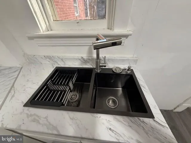a close view of a stove a sink and dishwasher in a kitchen