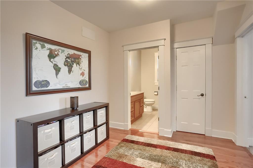 801 Main Street Coraopolis, PA 15108 - Photo 13 of 25 a view of a hallway with wooden floor and a bathroom